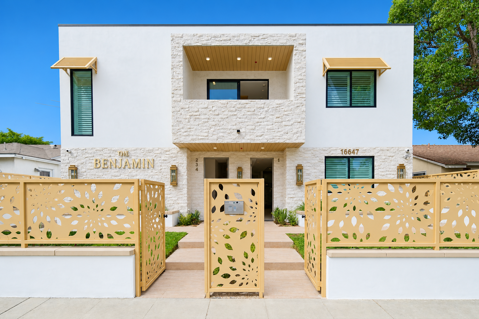 The Benjamin apartment building with decorative gated entry in soft daylight